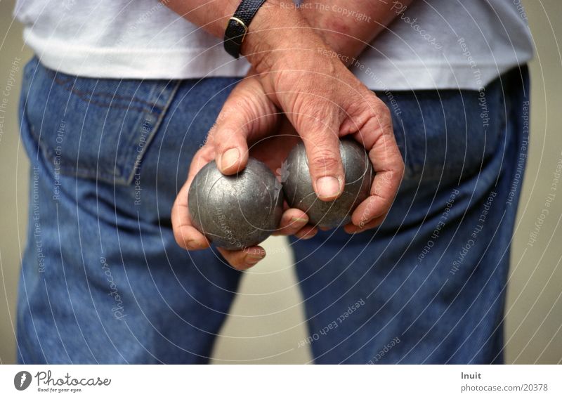 balls Boules Hand Jeans Detail Section of image Rear view Men`s hand Man Sphere boules ball boule balls To hold on