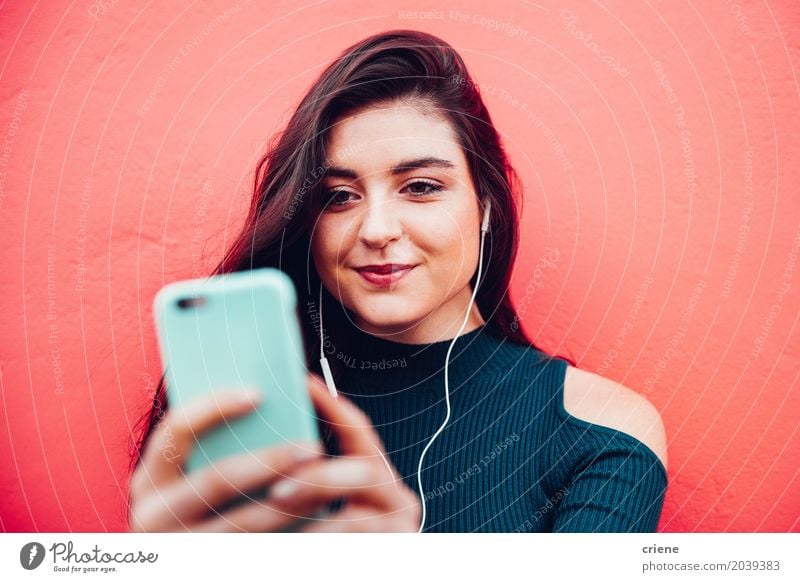 Young caucasian woman listening to music on smart phone Lifestyle Joy Music Cellphone MP3 player PDA Technology Entertainment electronics Telecommunications
