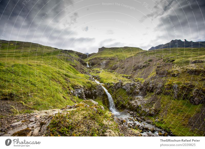 waterfall Environment Nature Landscape Hill Rock Gray Green White Waterfall Moody Iceland Pasture Travel photography Clouds Stone Colour photo Exterior shot