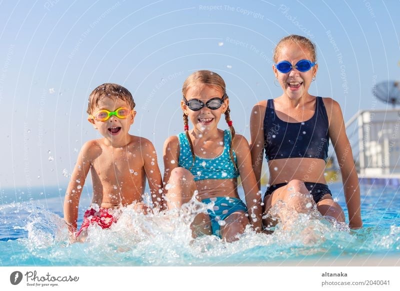 happy children playing near the swimming pool Lifestyle Joy Happy Face Relaxation Swimming pool Leisure and hobbies Playing Vacation & Travel Summer Sun Sports