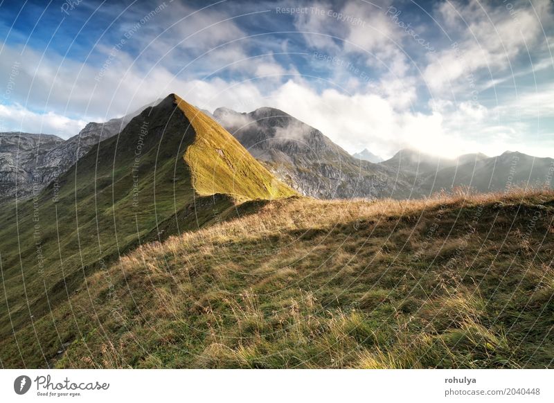 sunlight over mountain ridge and beautiful sky Vacation & Travel Mountain Hiking Nature Landscape Sky Clouds Summer Weather Beautiful weather Rock Alps Peak