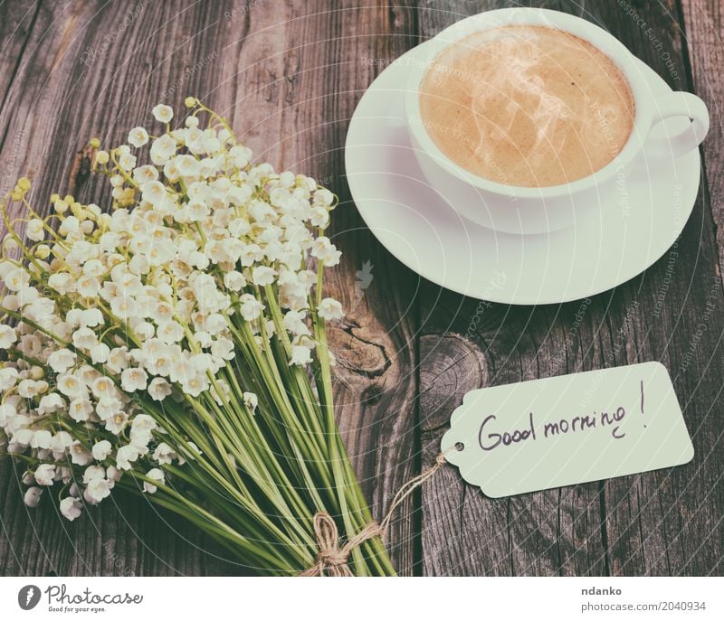 cup of hot black coffee and a bouquet Breakfast Hot drink Coffee Espresso Mug Table Restaurant Flower Bouquet Wood Blossoming Fresh Good Above Retro Brown Black