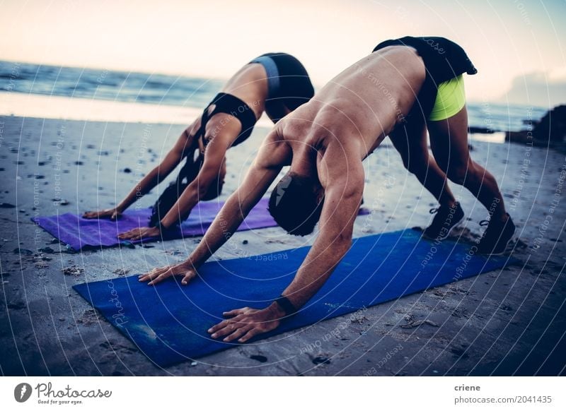 Fit young adult couple doing yoga on beach Lifestyle Personal hygiene Health care Athletic Fitness Leisure and hobbies Beach Ocean Waves Sports Yoga Woman