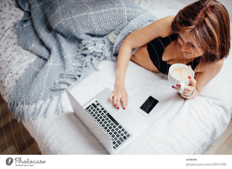 Young caucasian woman drinking coffee in bed with laptop Drinking Coffee Lifestyle Happy Leisure and hobbies Bedroom Study Computer Notebook Technology Internet