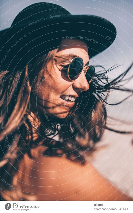 Young happy woman with sun hat at the beach Lifestyle Joy Relaxation Vacation & Travel Summer Summer vacation Sun Sunbathing Beach Human being Feminine