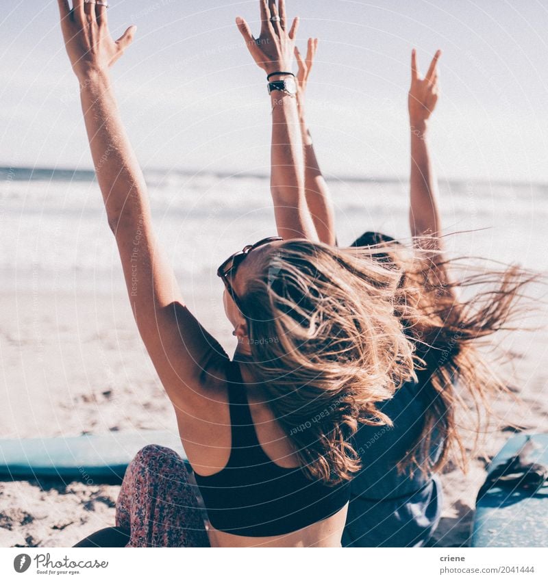 Two young woman cheering with hands up at the beach Lifestyle Joy Leisure and hobbies Vacation & Travel Tourism Adventure Freedom Summer Summer vacation Sun