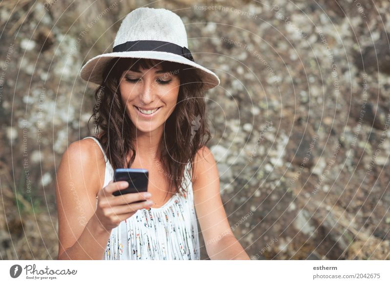young female using smartphone Lifestyle Telephone Cellphone Human being Feminine Young woman Youth (Young adults) Woman Adults Head 1 30 - 45 years Hat Brunette