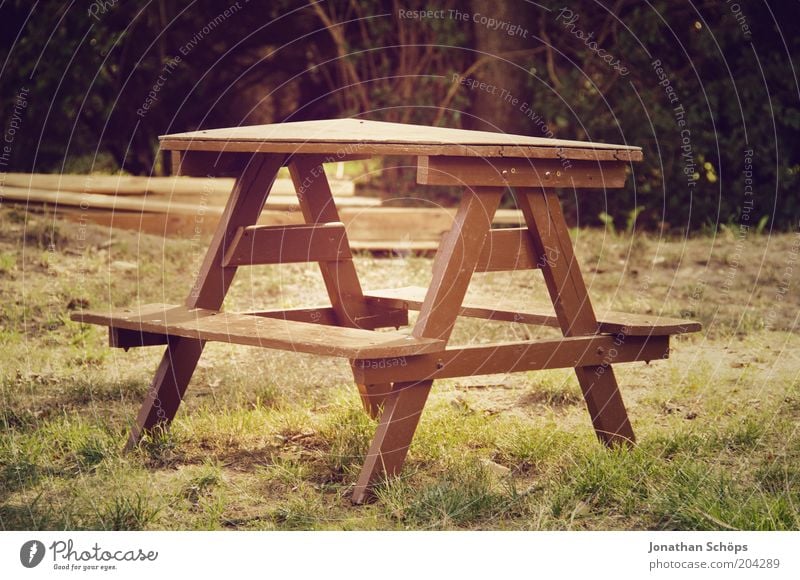 Table set you up Nature Esthetic Brown Green Calm Idyll Garden Wood Seating Bench Small Empty Unused Triangle Meadow Colour photo Exterior shot Deserted Light