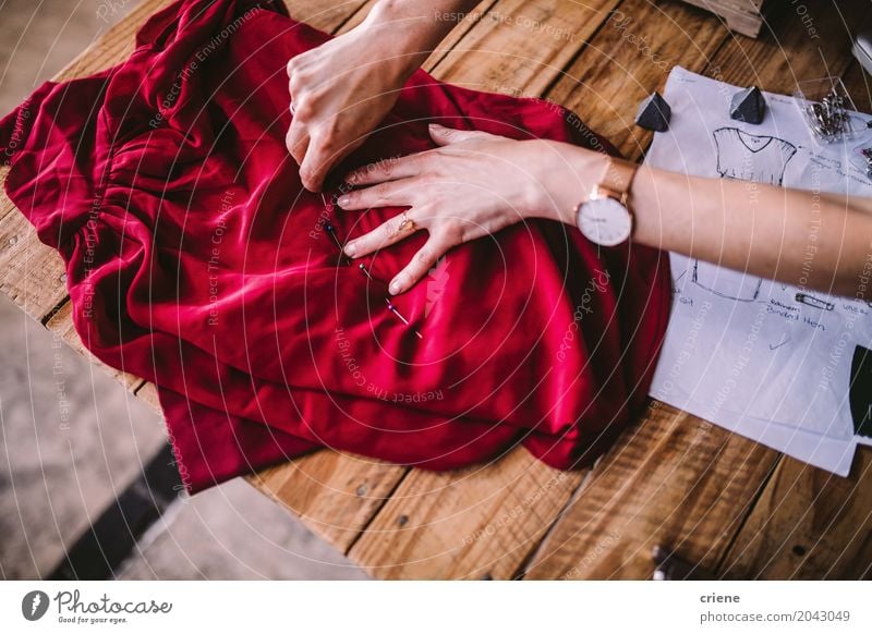 Close-up of female fashion designer working with textiles Lifestyle Design Leisure and hobbies Desk Work and employment Profession Workplace Office Factory