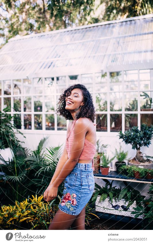 Portrait of smiling African American woman in tropical garden Lifestyle Joy Harmonious Summer Summer vacation Garden Human being Feminine Woman Adults 1