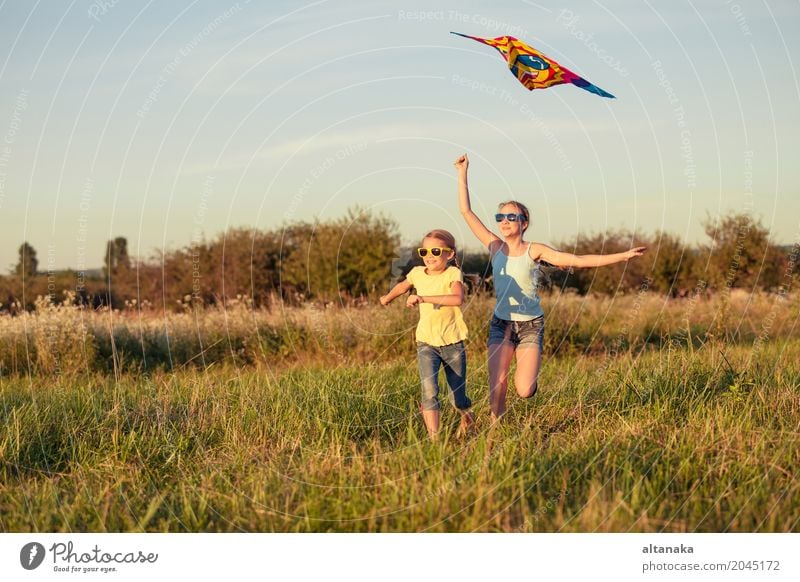 Happy children playing on the field at the day time. Lifestyle Joy Beautiful Leisure and hobbies Playing Vacation & Travel Freedom Camping Summer Child
