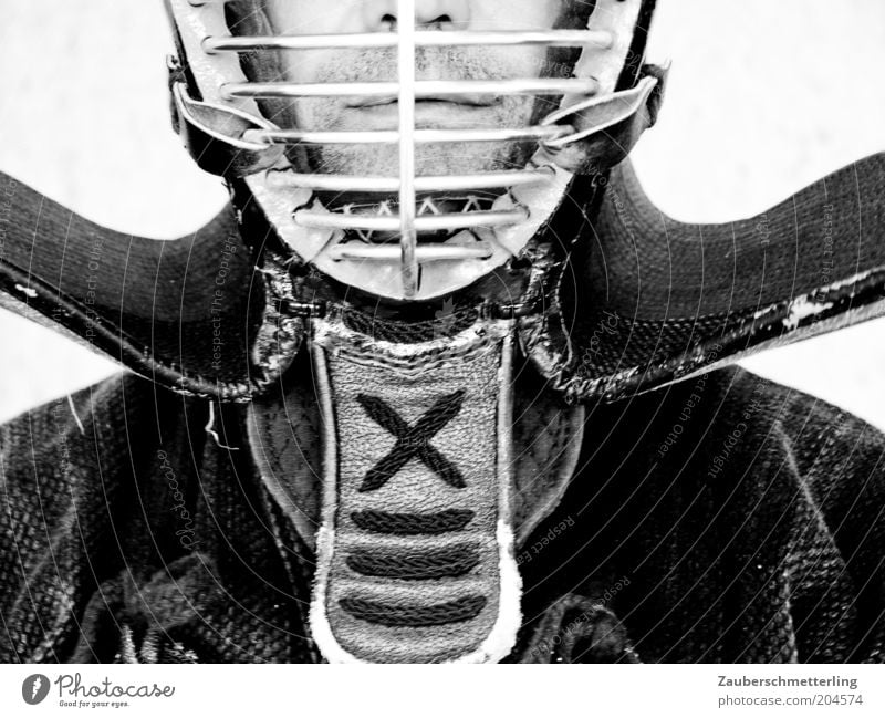 behind bars Martial arts Masculine Nose Mouth Lips Protective clothing Helmet Exceptional Threat Self-confident Unwavering Protection Black & white photo
