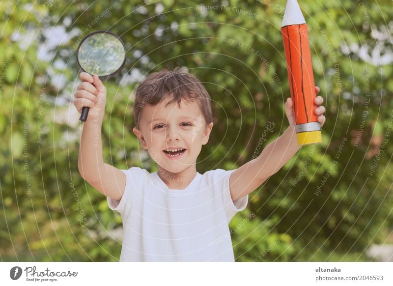 Smiling young child in a uniform Lifestyle Joy Happy Beautiful Relaxation Leisure and hobbies Freedom Summer Child School Human being Boy (child) Man Adults