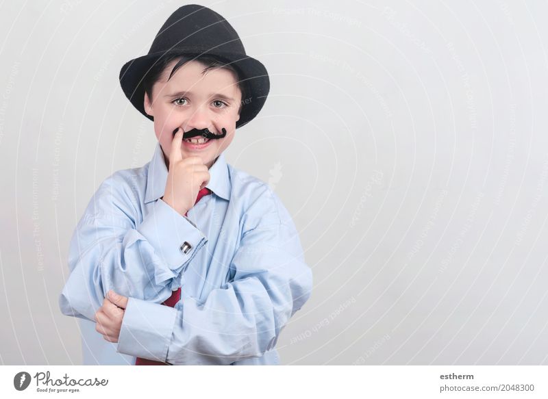 Funny boy with fake mustache and tie Lifestyle Party Event Feasts & Celebrations Mother's Day Carnival Parenting Education Child Work and employment Profession