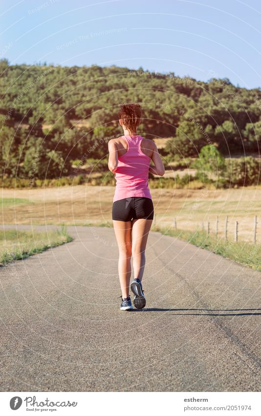 Girl running on the road - a Royalty Free Stock Photo from Photocase