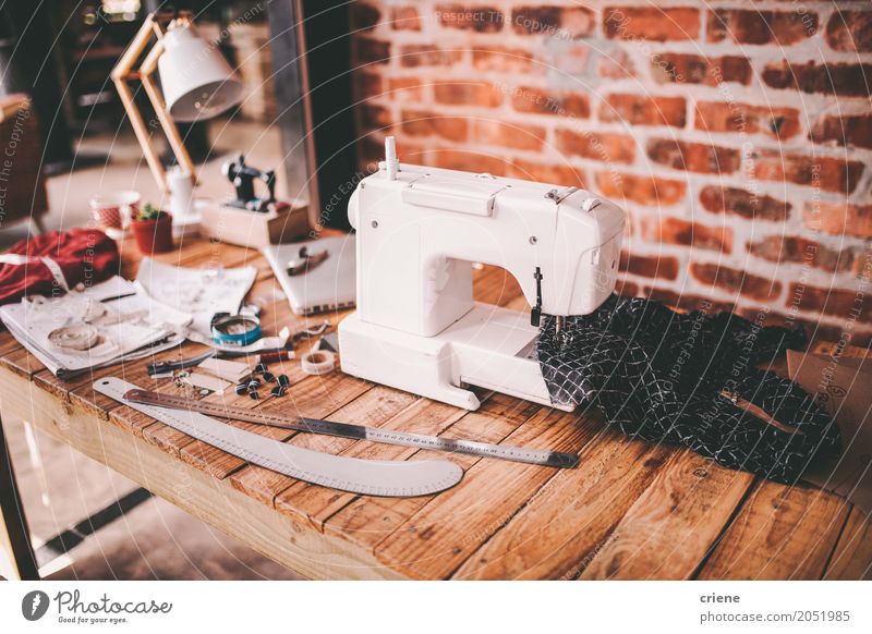 Desk of fashion designer with sewing machine and tools Lifestyle Handcrafts Work and employment Profession Office work Workplace Factory Craft (trade) Business