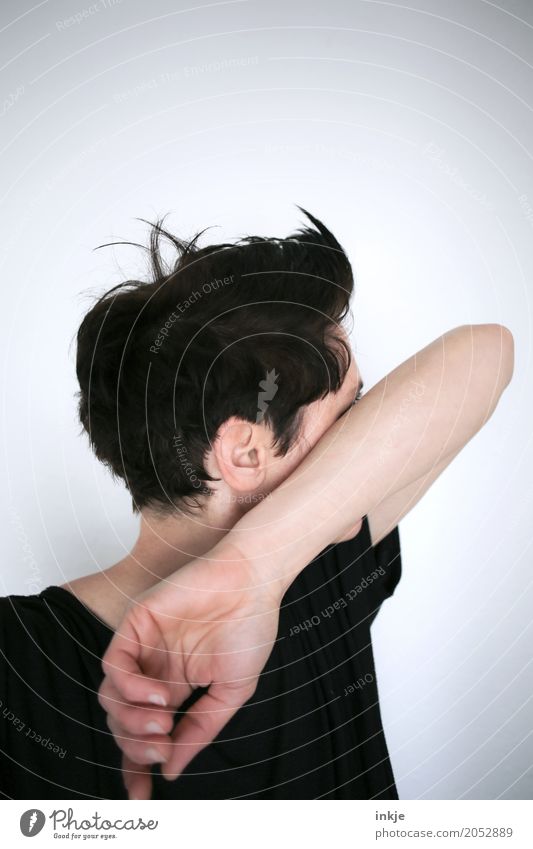 Woman with short hair hides her face behind her arm Lifestyle Style Hair and hairstyles Leisure and hobbies Adults Head Arm 1 Human being 30 - 45 years