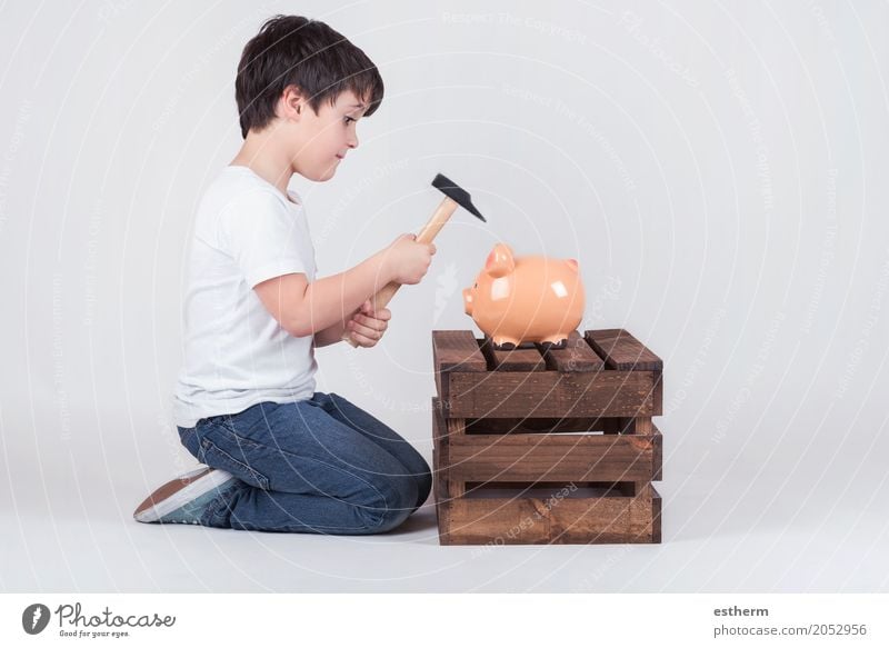 Little boy, His breaking piggy bank Lifestyle Shopping Luxury Money Economy Financial institution Business Human being Child Toddler Boy (child) Infancy 1