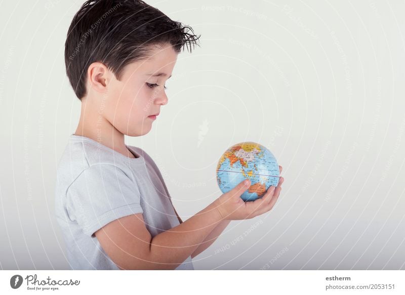 Boy looking at a toy globe. child holding earth in hands Lifestyle Human being Masculine Child Toddler Boy (child) Infancy 3 - 8 years Sphere Globe