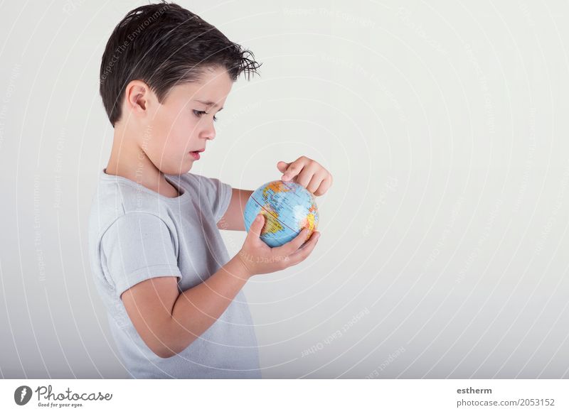 Boy looking at a toy globe. child holding earth in hands Lifestyle Vacation & Travel Tourism Trip Adventure Human being Masculine Child Toddler Boy (child)