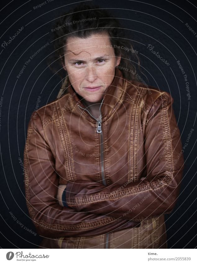 AST 10 | Sista Feminine Woman Adults Human being Wall (barrier) Wall (building) Jacket Leather Leather jacket Brunette Long-haired Observe Think To hold on