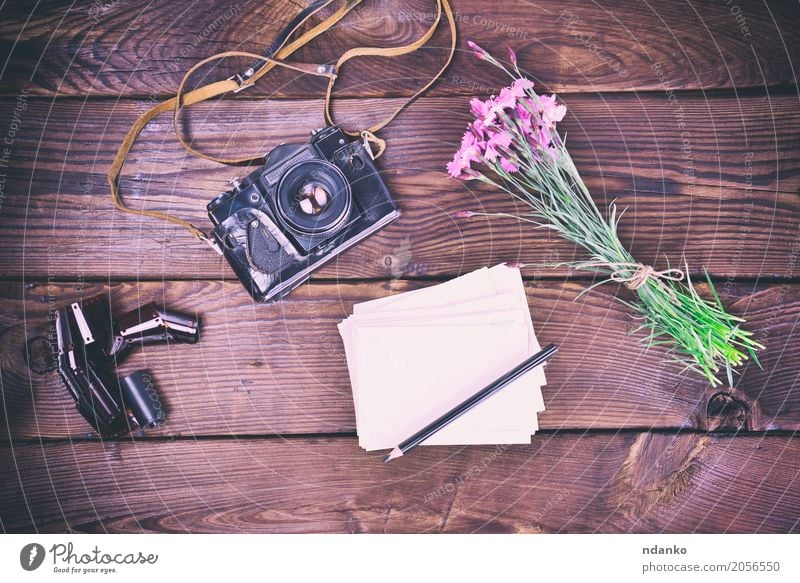 Blank greeting card and old vintage film camera Vacation & Travel Camera Flower Bouquet Wood Old Brown Pink Pencil background Dianthus caryophyllus Top