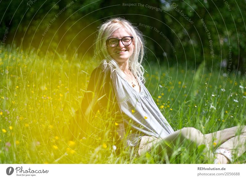 Woman with dreads sitting on a meadow portrait Youth (Young adults) Young woman Feminine Human being Looking into the camera Upper body Nature Environment