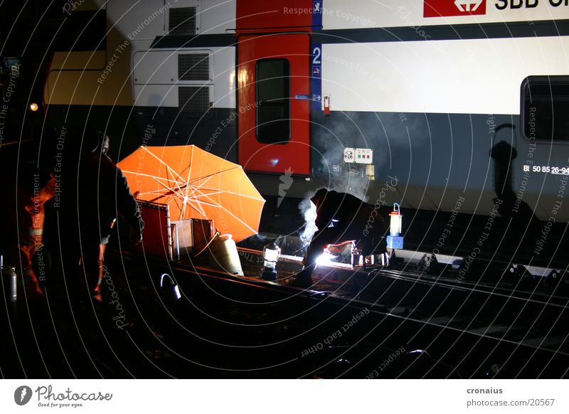welding work 1 Night Railroad tracks Gas burner Electrical equipment Technology Umbrella Orange sbb Electricity