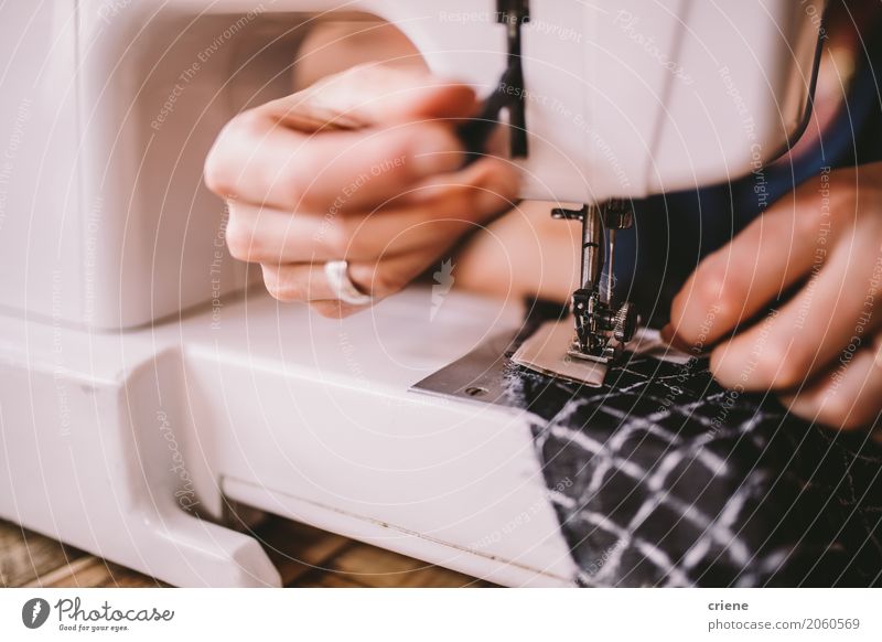 Close-up of woman sewing with sewing machine Lifestyle Handcrafts Work and employment Profession Workplace Services Business SME Career Sewing machine Feminine