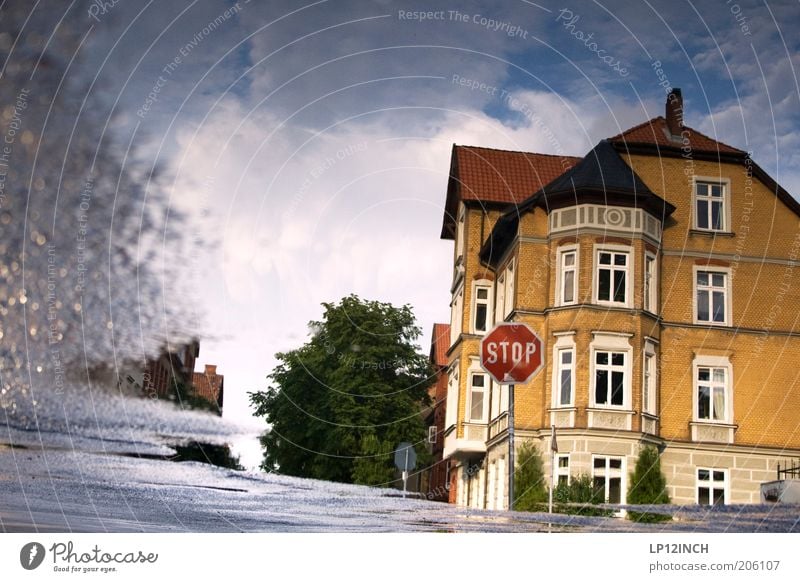 Puddle STOP Environment Luneburg Small Town Old town Building Architecture Transport Street Crossroads Road sign Bizarre Surrealism