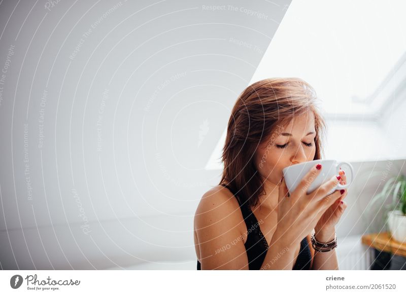 Woman enjoying cup of fresh tea in the morning Beverage Drinking Hot drink Coffee Tea Cup Mug Lifestyle Joy Wellness Leisure and hobbies Living room Human being