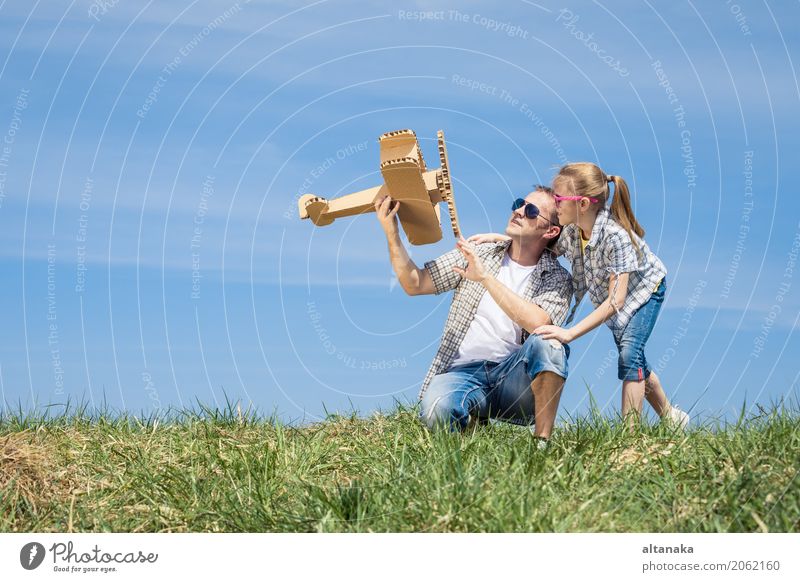 Father and daughter playing with cardboard toy airplane Lifestyle Joy Happy Leisure and hobbies Playing Vacation & Travel Adventure Freedom Summer Sports Child