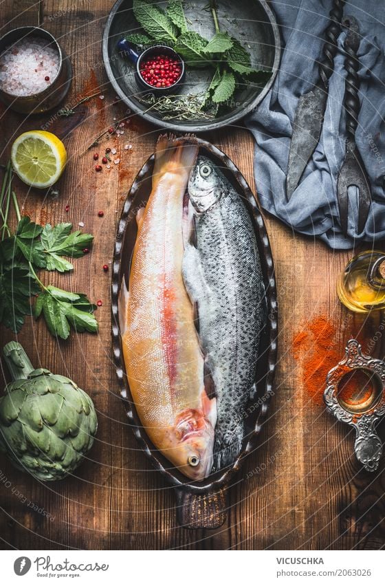 Trout fish in baking tin on the kitchen table Food Fish Vegetable Herbs and spices Cooking oil Nutrition Dinner Organic produce Vegetarian diet Diet Crockery
