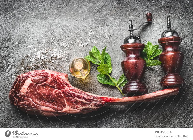 RoherTomahawk beef steak with spices, salt and pepper shaker Food Meat Herbs and spices Cooking oil Nutrition Dinner Business lunch Organic produce Style Design