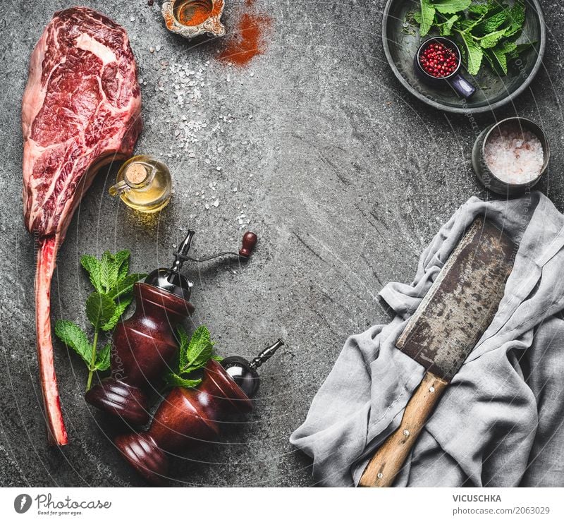 Tomahawk beef steak with knife, spices and fresh herbs Food Meat Herbs and spices Cooking oil Nutrition Lunch Organic produce Crockery Knives Style Design Table