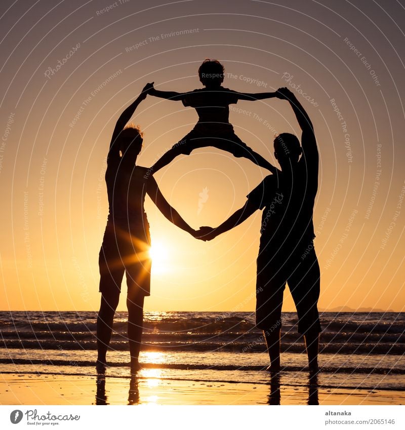 Silhouette of happy family Lifestyle Joy Leisure and hobbies Playing Vacation & Travel Trip Adventure Freedom Summer Sun Beach Ocean Sports Child Boy (child)