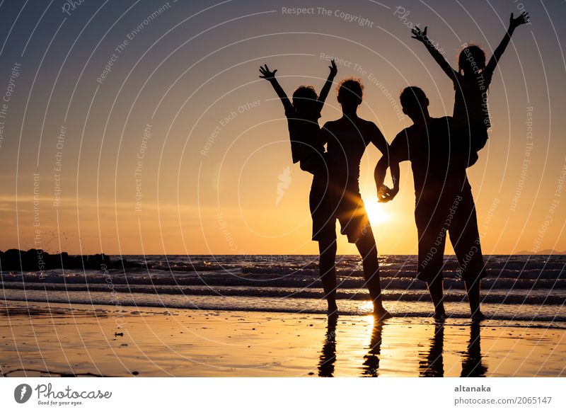 Silhouette of happy family Lifestyle Joy Leisure and hobbies Playing Vacation & Travel Trip Freedom Summer Sun Beach Ocean Sports Child Boy (child) Woman Adults