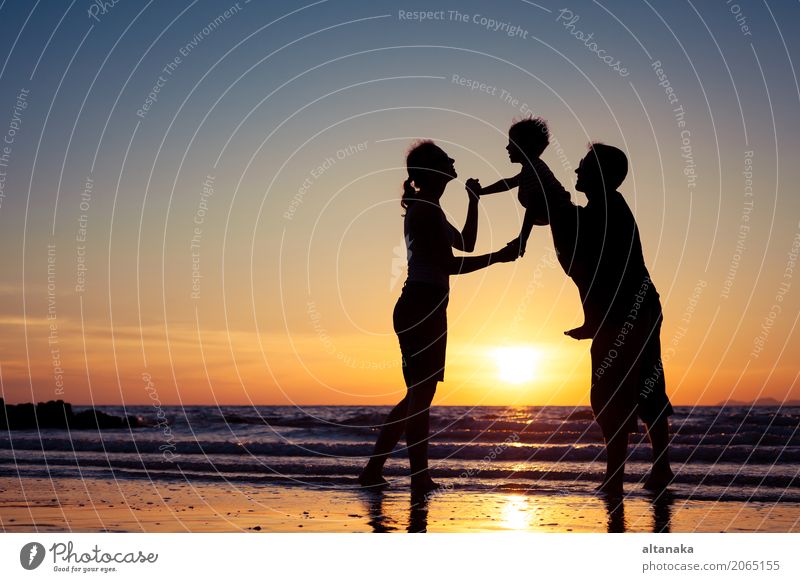 Silhouette of happy family Lifestyle Joy Leisure and hobbies Playing Vacation & Travel Trip Adventure Freedom Summer Sun Beach Ocean Sports Child Boy (child)