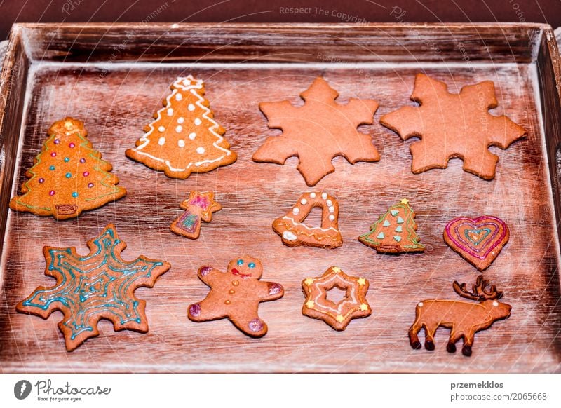 Christmas cookies decorated with frosting on wooden board Decoration Table Feasts & Celebrations Wood Make Tradition Baking biscuit cake christmas cooking
