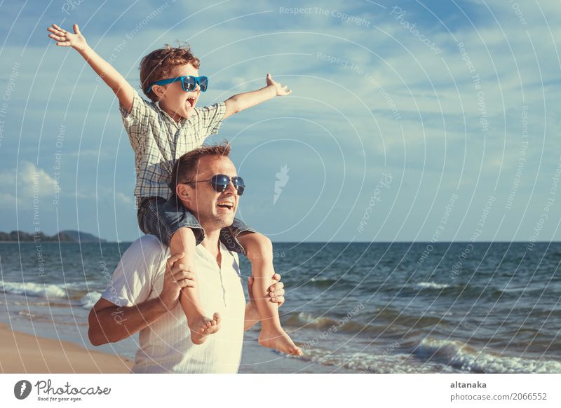 Father and son playing on the beach Lifestyle Joy Relaxation Leisure and hobbies Playing Vacation & Travel Trip Adventure Freedom Summer Sun Beach Ocean Child