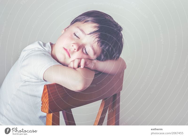 Child asleep on a chair Lifestyle Chair Human being Masculine Toddler Boy (child) Infancy 1 3 - 8 years Lie Sleep Sit Cuddly Emotions Love Dream Sadness
