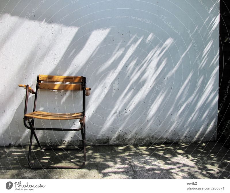 Still not there, the director? Chair Environment Climate Weather Beautiful weather Wall (barrier) Wall (building) Facade Relaxation Sharp-edged Simple Bright