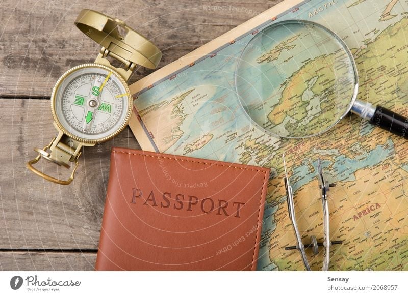 compass and vintage map on the wooden desk Vacation & Travel Trip Adventure Decoration Desk Earth Wall (barrier) Wall (building) Leather Old Historic Retro gold