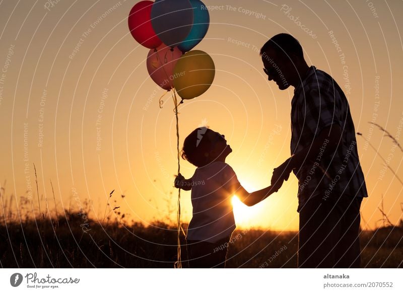 Father and son playing with balloons in the park Lifestyle Joy Happy Leisure and hobbies Vacation & Travel Adventure Freedom Camping Summer Sun Hiking Sports