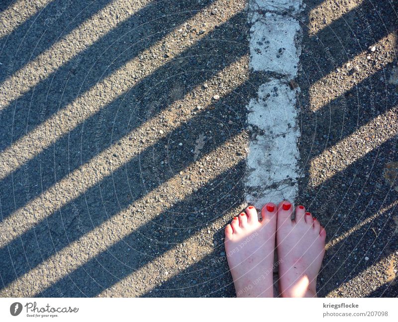 barefooter Feminine Feet Pedestrian Street Lanes & trails Discover Walking Red Nail polish Sideline White Stand Gray Stripe Colour photo Exterior shot