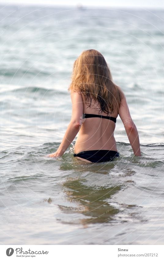 Woman goes in the water Adults Hair and hairstyles Back 1 Human being Water Summer Beautiful weather Waves Ocean Bikini Long-haired Swimming & Bathing Wet