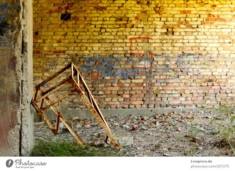 solitary rack Wall (barrier) Wall (building) Metal Dirty Broken Brown Yellow Authentic Destruction Colour photo Exterior shot Deserted Central perspective