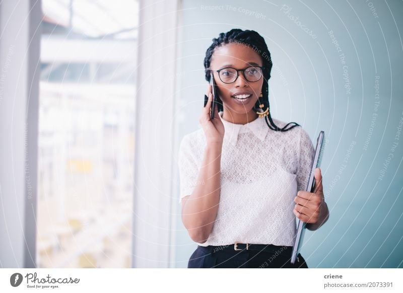 African businesswoman in a conversation on the phone Success Work and employment Profession Office Financial Industry Business Career To talk Telephone PDA