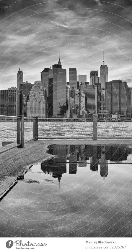 Manhattan skyline reflected in a puddle. Vacation & Travel Sky Town Downtown Skyline High-rise Building Architecture Street Retro Gray Black White Life New York