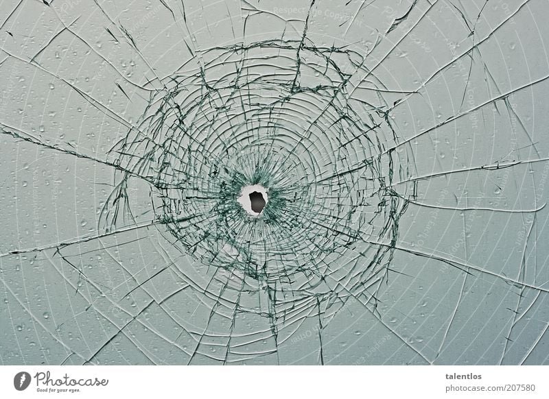 bullet hole Window Glass Broken Smashed window broken glass Colour photo Exterior shot Abstract Pattern Structures and shapes Copy Space left Copy Space right